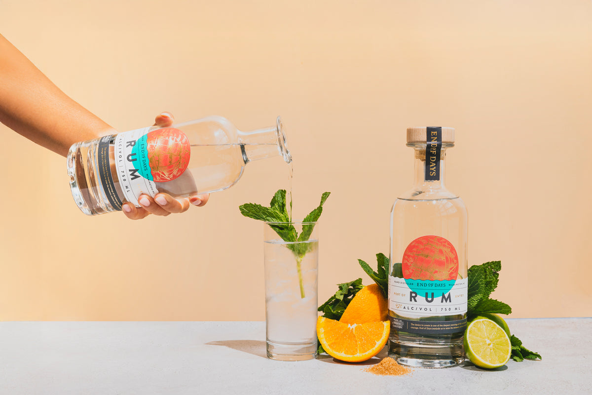 Port of Entry Rum being poured into a mint and citrus cocktail