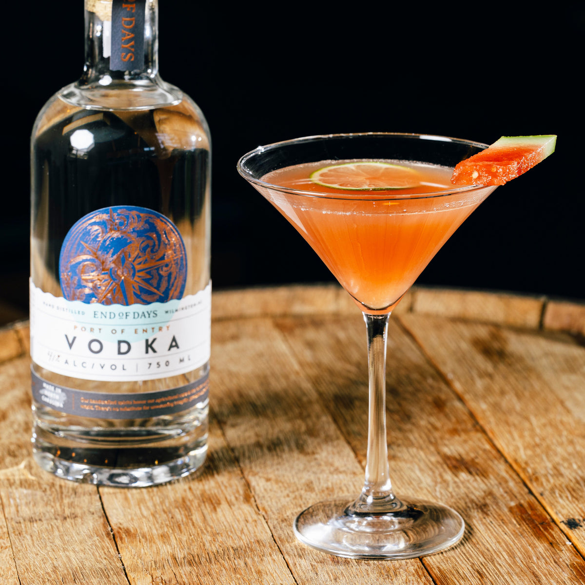 Port of Entry Vodka with a pink martini on an oak barrel
