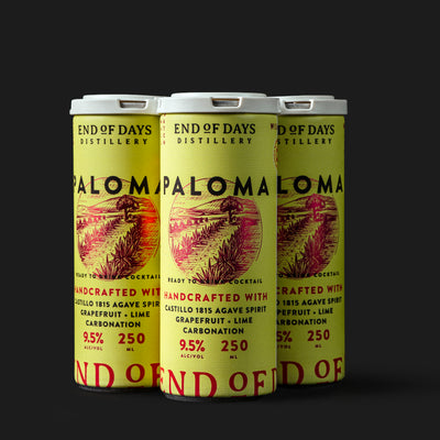 Paloma craft cocktail in a can 4-pack on a black background