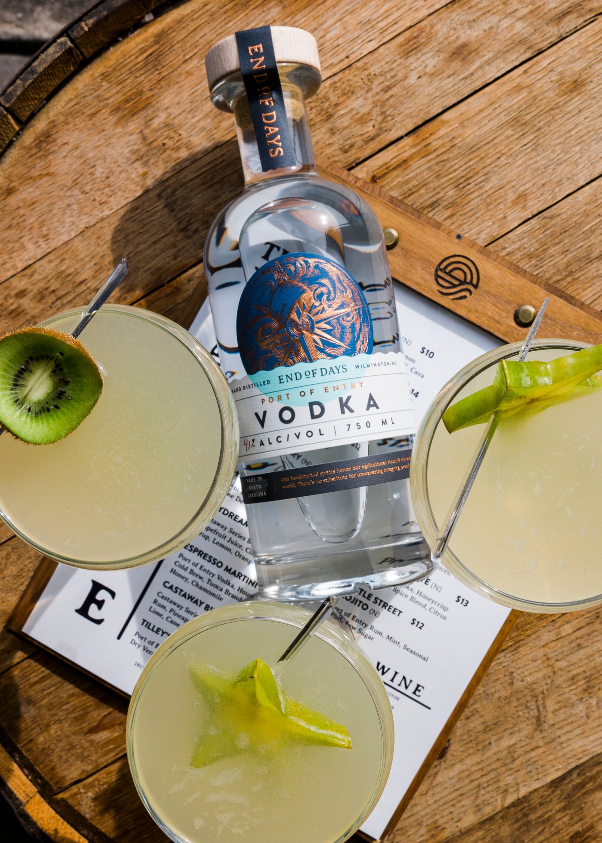 Port of Entry Vodka with two lime cocktails, top view